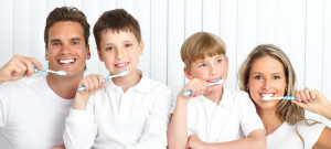 happy family brushing their teeth