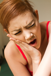 woman suffering from tmj disorder